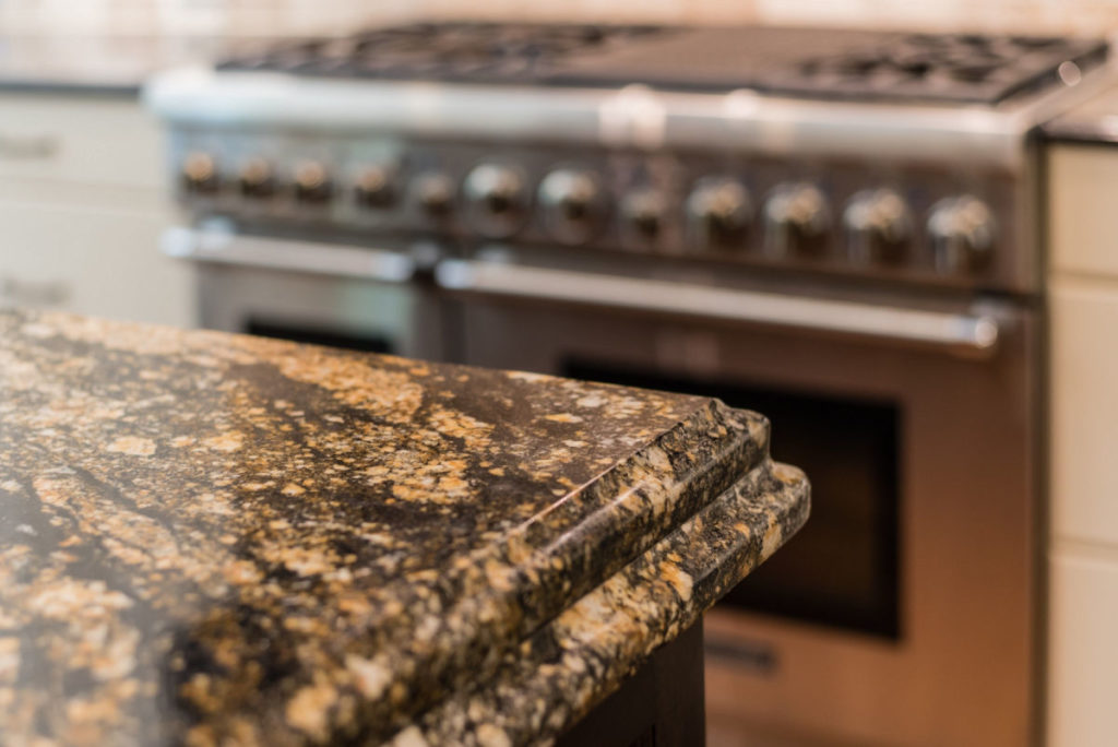 Brown and tan speckled granite countertop installed in the kitchen - Granite Countertops in Lancaster Kitchens - Pros, Cons & Buying Tips